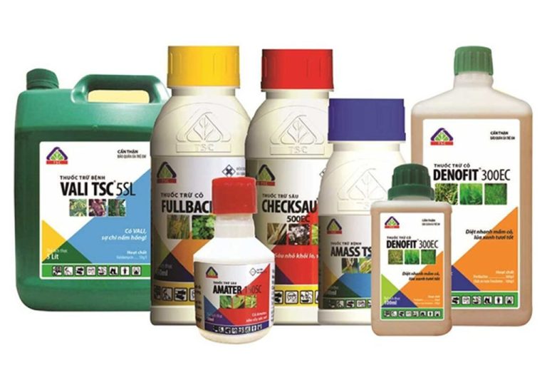 Chemical labels with GHS hazard symbols on containers
