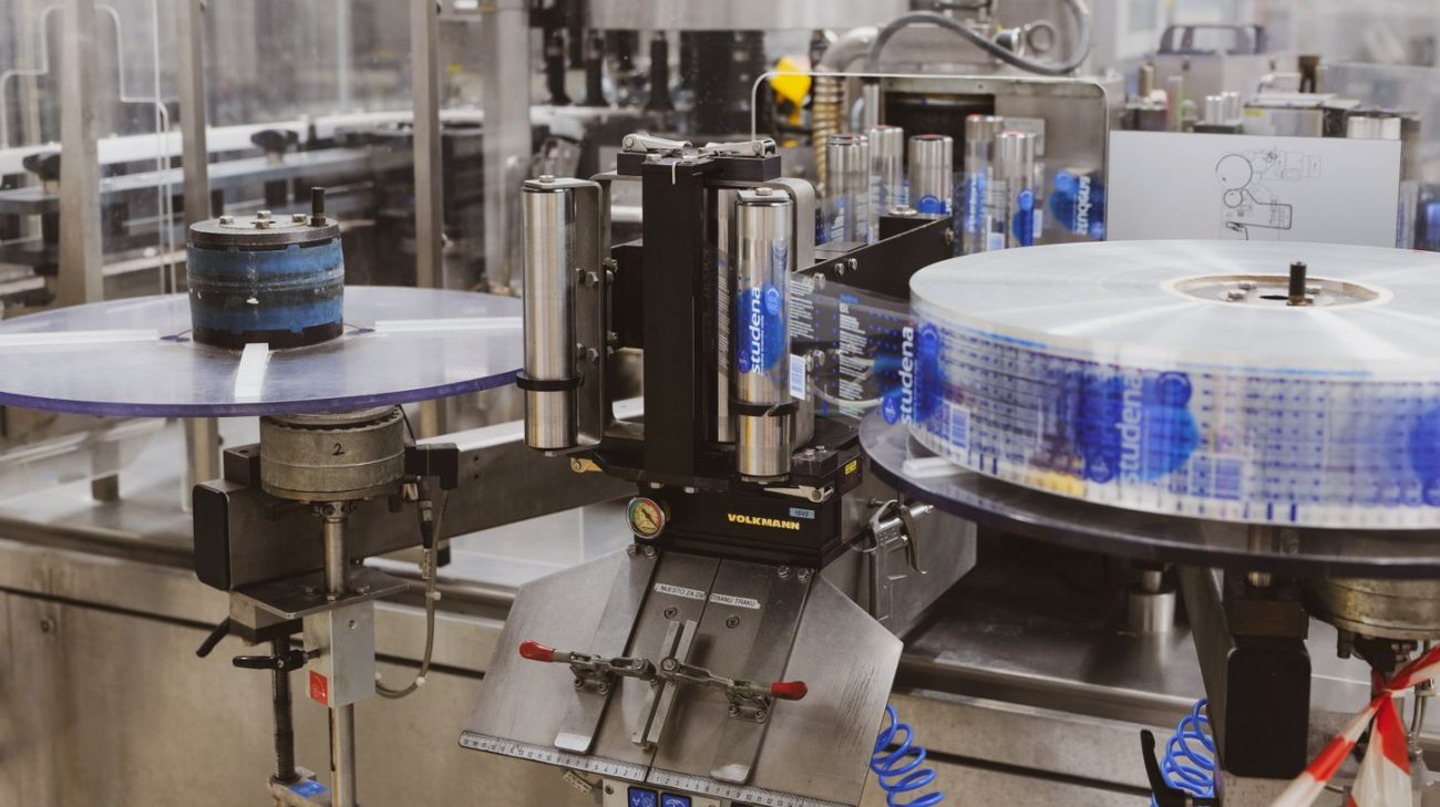 Automated packaging machinery running at production speed in a plant