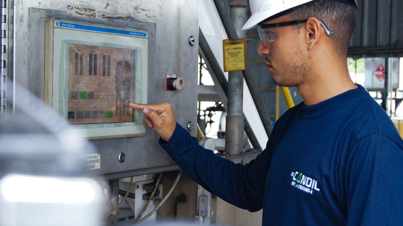 Engineer working at a modern coder interface with usage data on screen