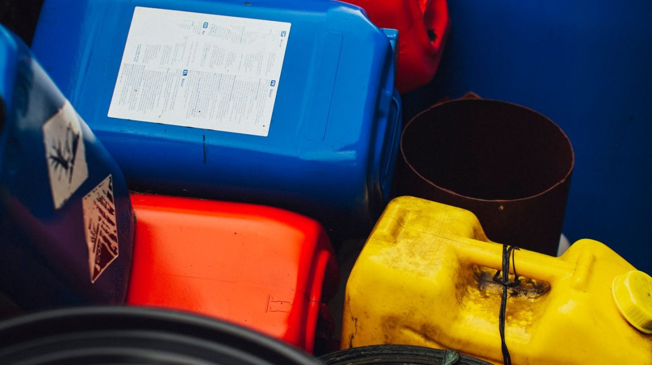 GHS hazard pictogram and signal word printed on a chemical container label