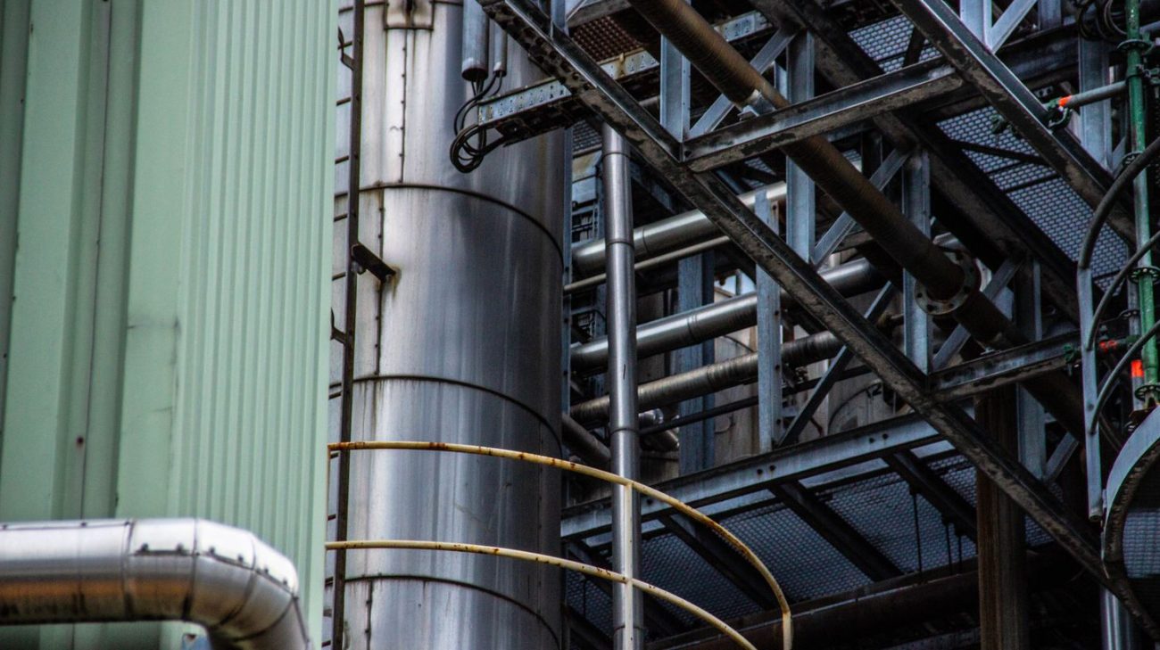Insulated tanks and pipework inside a processing facility