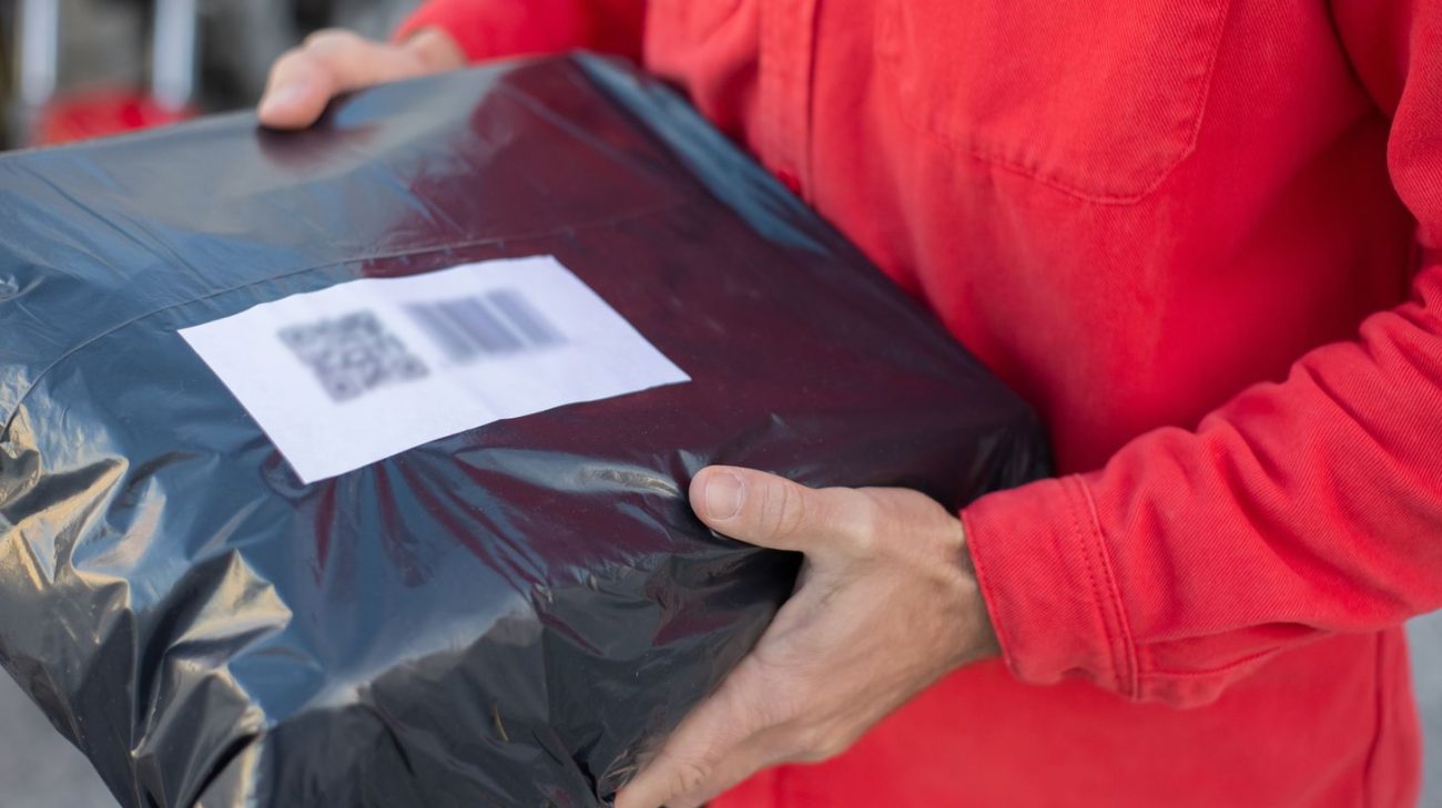 Close-up of a parcel barcode label ready to be scanned in transit