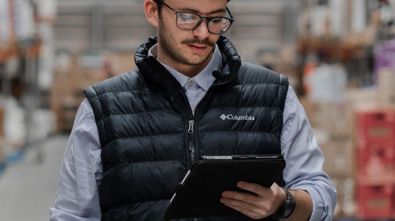 Team member planning a barcode scanner rollout on a tablet