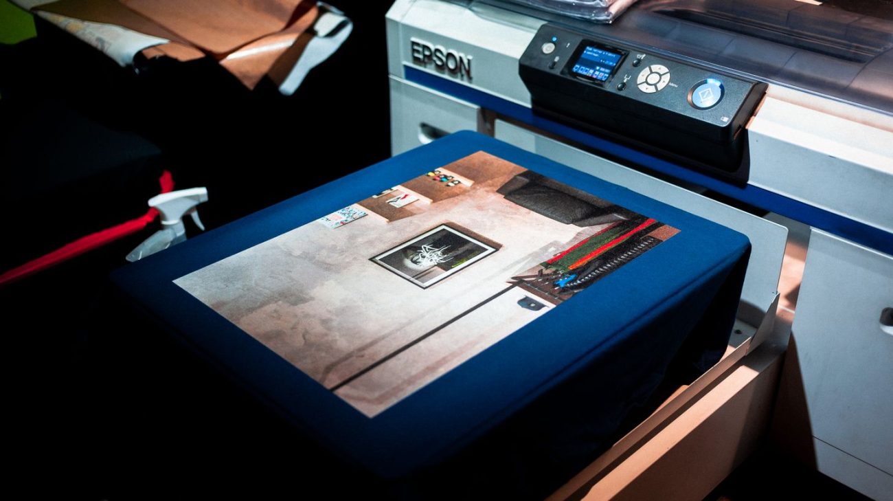 Close-up of a professional printer producing a custom artwork design