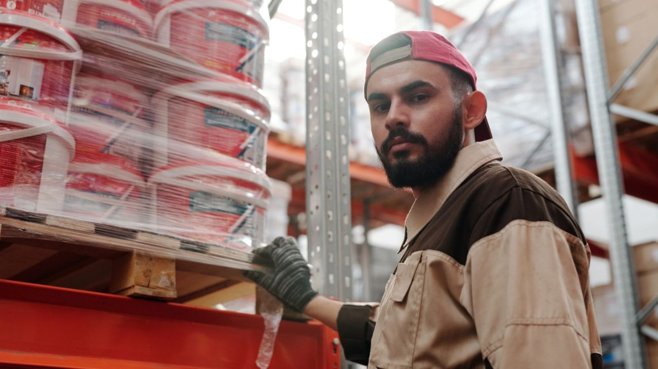 Warehouse operative checking shelf stock against a count